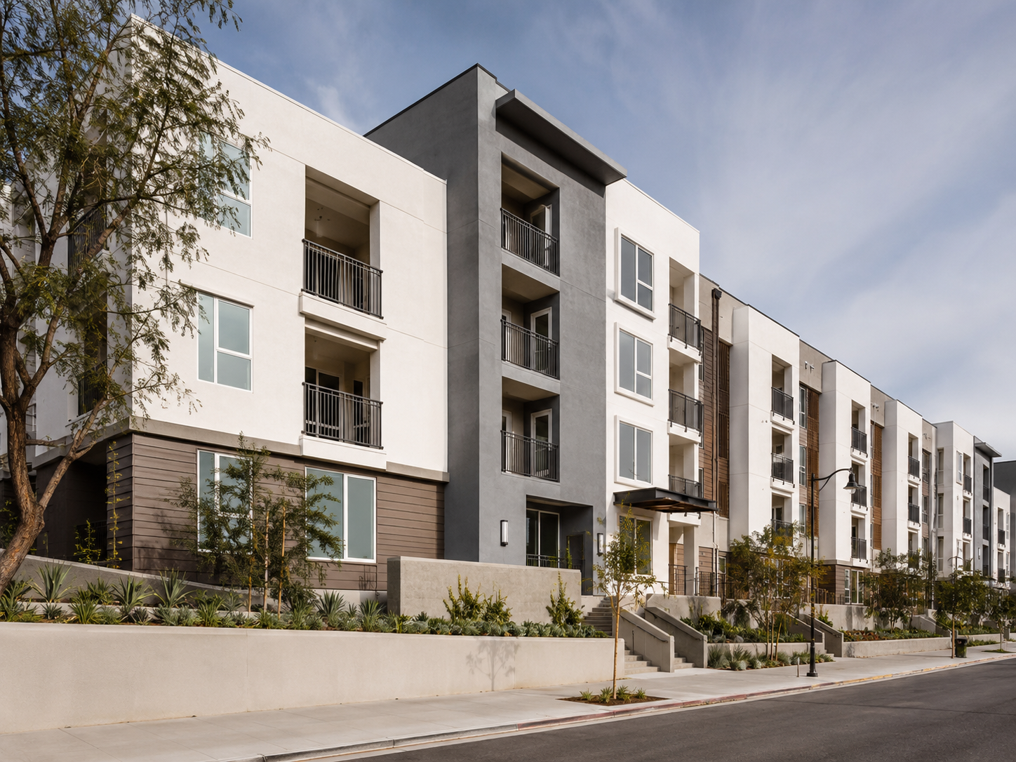 Modern multifamily residential development with finished stucco exterior elevations