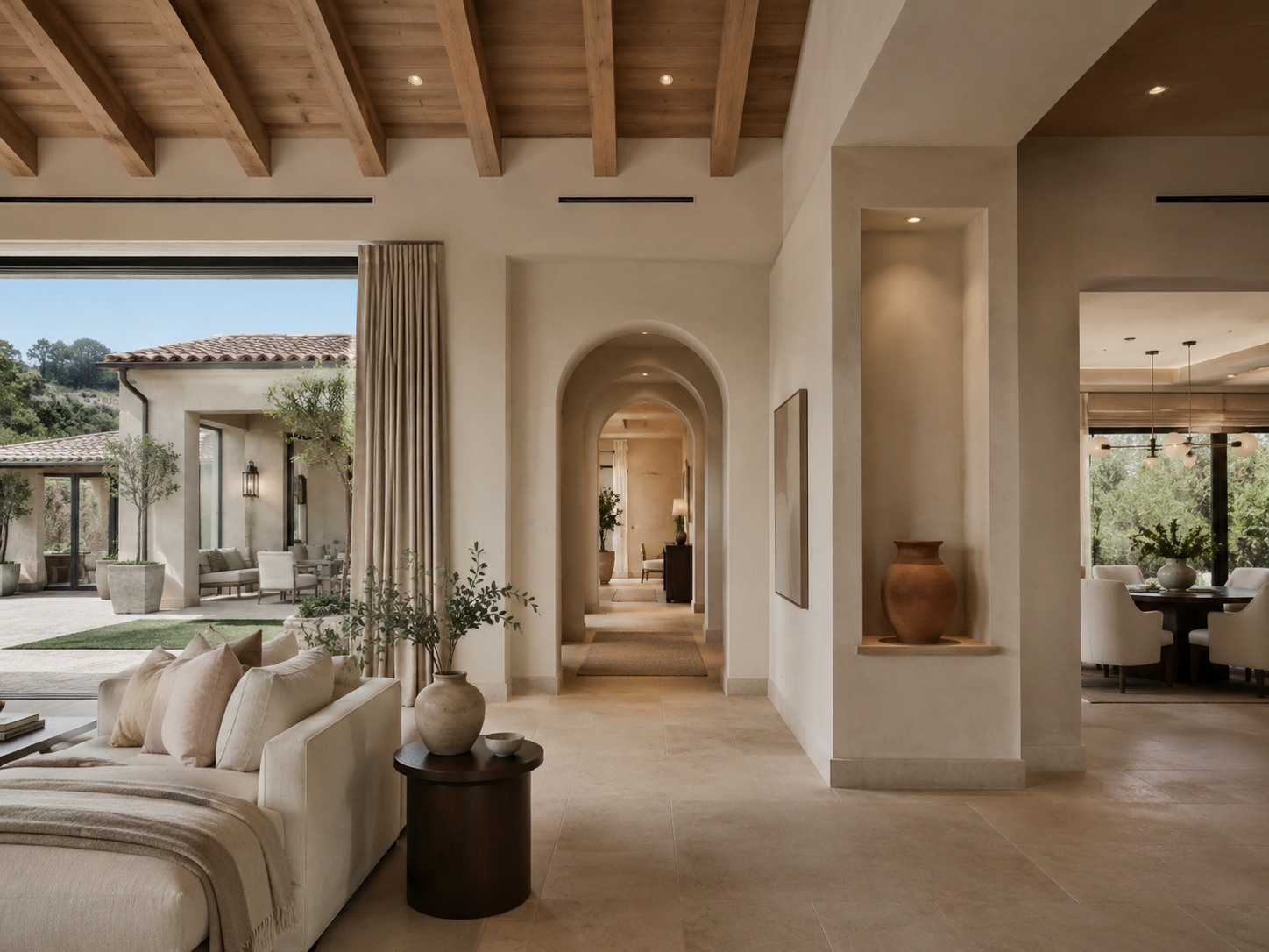 High-end custom-home interior with smooth walls, architectural arches and refined finish details